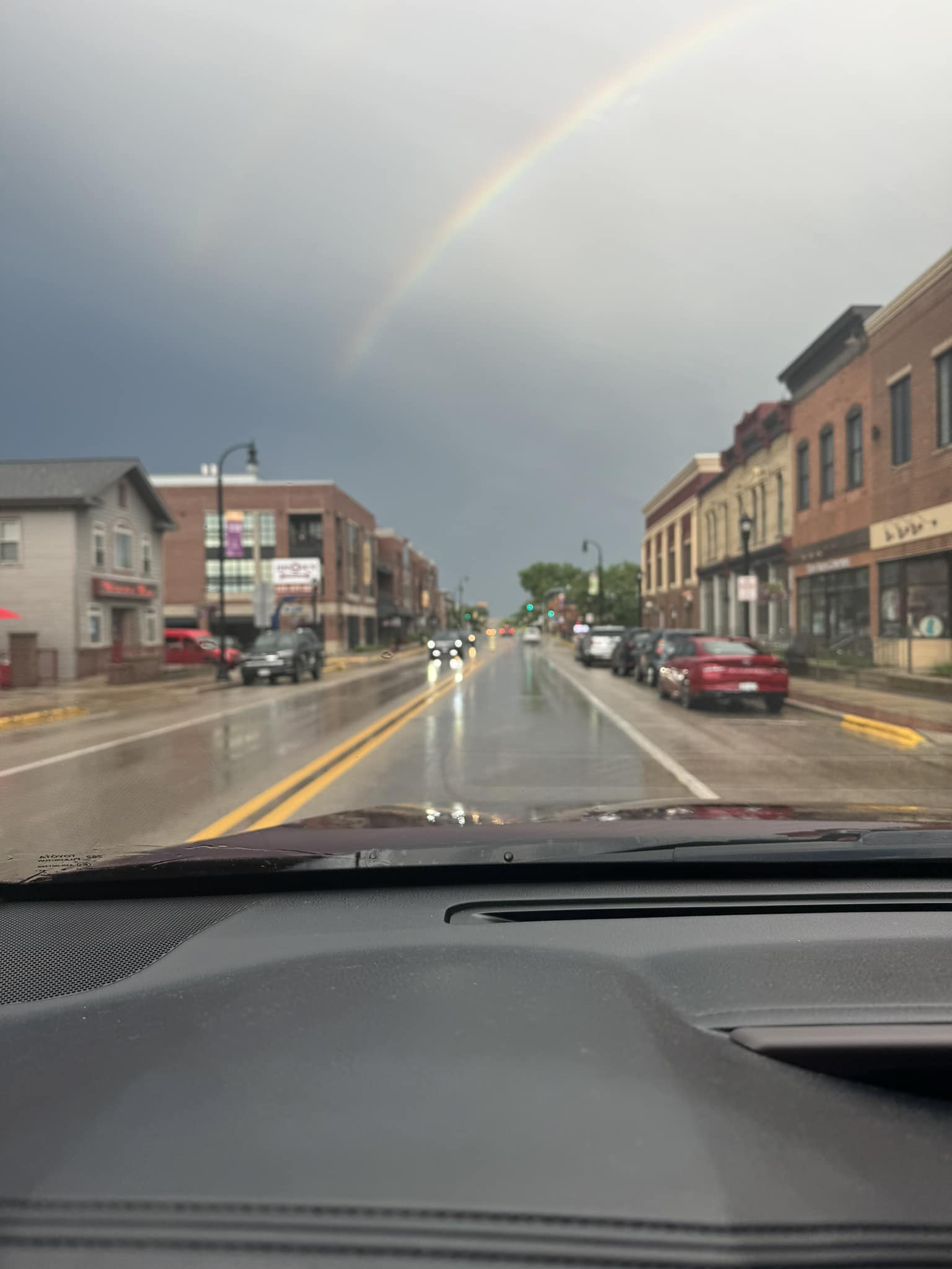 Rainbow out dashboard while driving food truck.